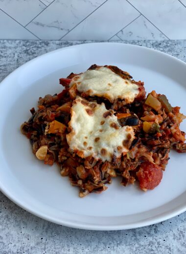 An image of a plate with stuffed bell peppers on it