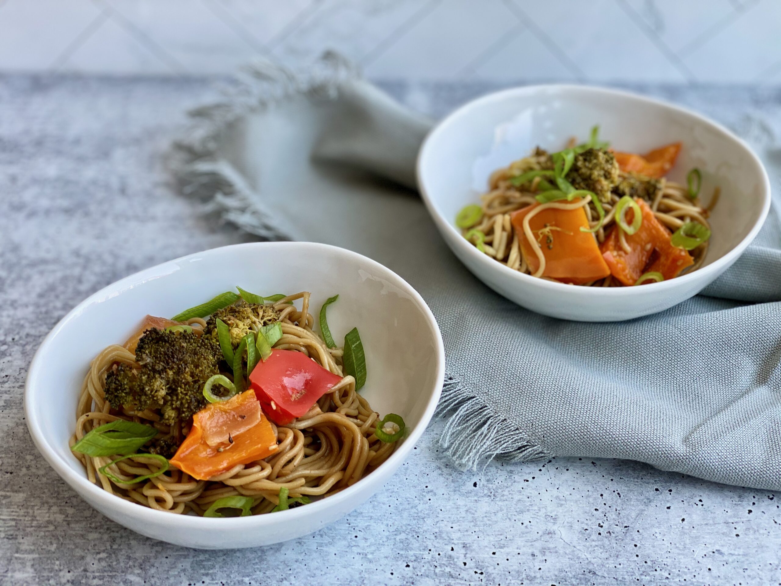 Image of two bowls with ramen noodles and veggies