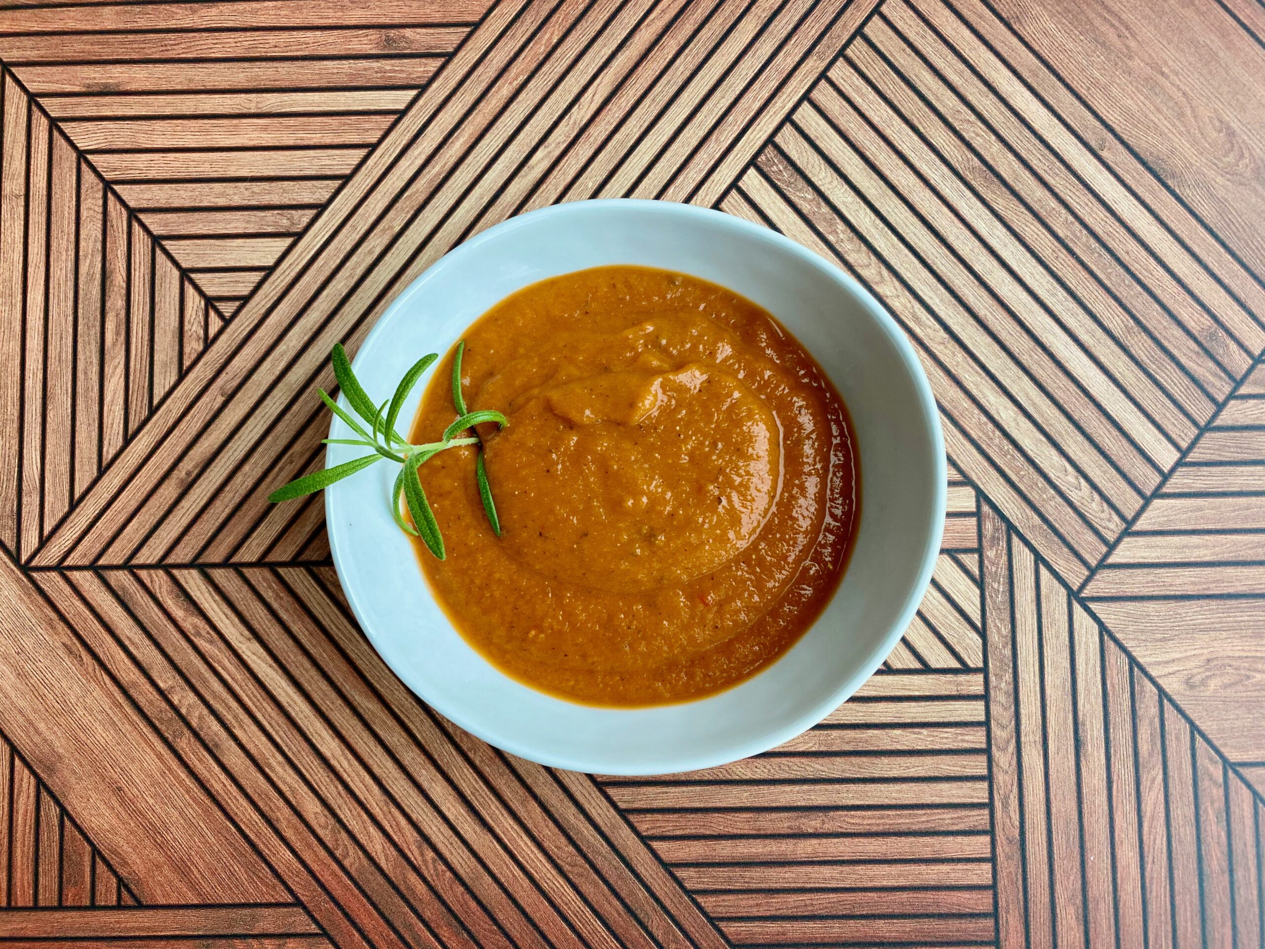 An image of a bowl full of tomato soup
