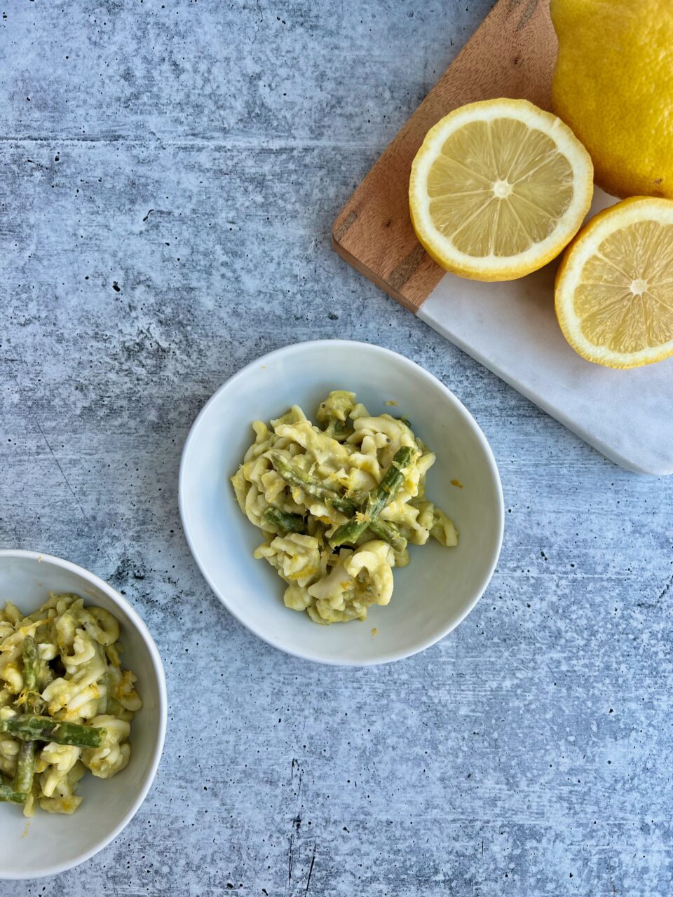 Picture of a bowl of pasta with asparagus and lemons