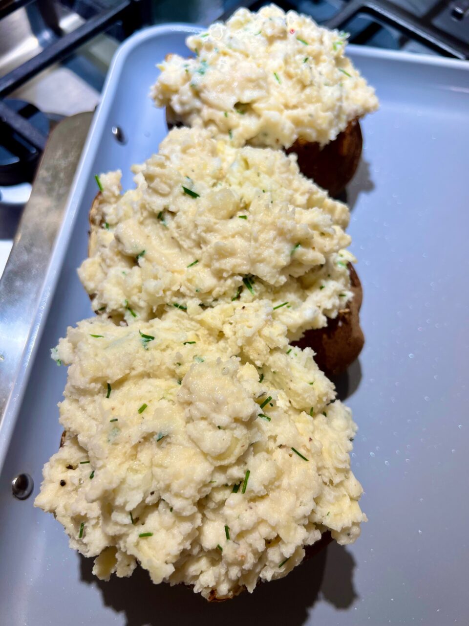 Baked potatoes on a baking sheet