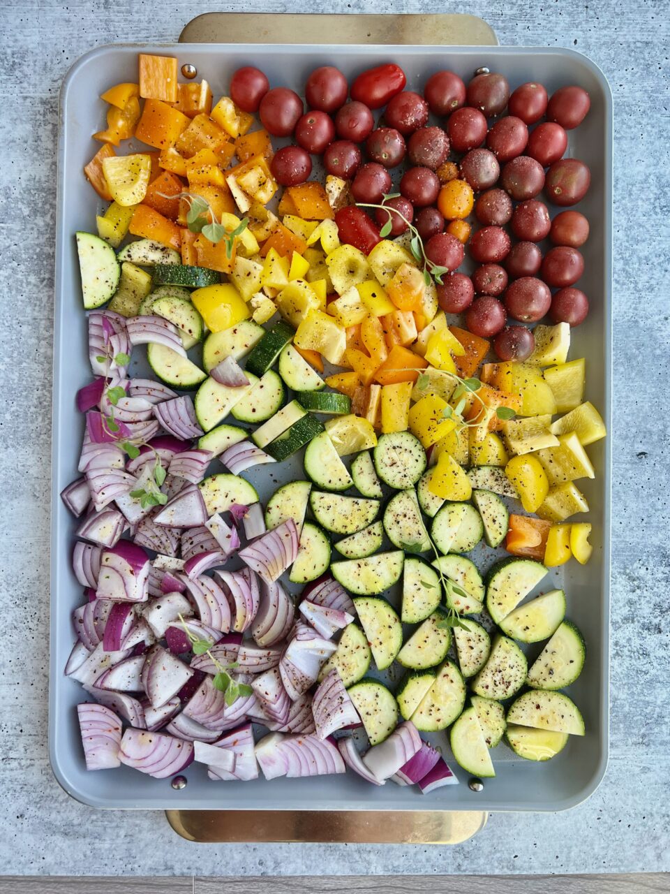 A cookie sheet with colorful vegetables